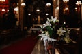 Selective focus shot of a flower bouquet on a chair in the church