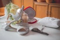 Selective focus shot of flowers, symbolizing wedding rings in a box and bride's accessories Royalty Free Stock Photo