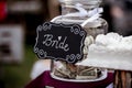 Selective focus shot of a glass jar full of money for the bride Royalty Free Stock Photo