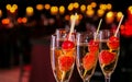 Selective focus shot of glasses of delicious wine with strawberry