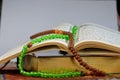 Selective focus shot of the Holy Koran book with rosary beads Royalty Free Stock Photo