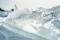 Selective focus shot of an ice floe breaking up against shore during freezing winter weather