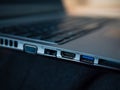 Selective focus shot of laptop ports - VGA, network, HDMI, USB