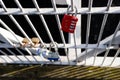 Selective focus shot of locked combination padlock attached to a bridge