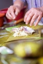 Selective focus shot of making Cassava Suman in a banana leaf Royalty Free Stock Photo