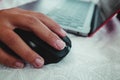 Selective focus shot of a male hand using a wireless computer mouse Royalty Free Stock Photo