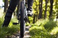 Selective focus shot of a male riding a bike in the nature Royalty Free Stock Photo