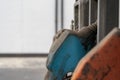 Selective focus shot of an old blue gas pump nozzle in a gasoline station Royalty Free Stock Photo