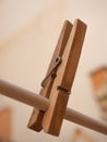 Selective focus shot of one wooden clothespin on the rope Royalty Free Stock Photo