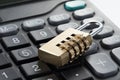Selective focus shot of a padlock on a calculator - concept of financial security