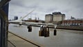 Selective focus shot of padlocks hanging on Woman's bridge in Puerto Madero, Buenos Aires