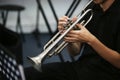 Selective focus shot of a person playing the trumpet Royalty Free Stock Photo