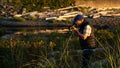 Selective focus shot of a photographer taking pics in Park in Campbell River, BC Canada