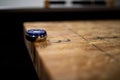 Selective focus shot of a puck on the edge of the table shuffleboard Royalty Free Stock Photo