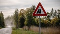 Selective focus shot of a road sign in the right side