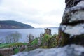 Selective focus shot of the ruins of Urquhart Castle, Edinburgh under cloudy sky