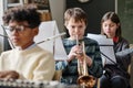 Boy Playing Trumpet In Orchestra At School Royalty Free Stock Photo