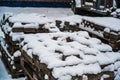 Selective focus shot of a snow-covered stack of paving stones Royalty Free Stock Photo