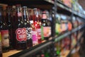 Selective focus shot of Soda pop store cherry soft drink beverage bottle on the shelf Royalty Free Stock Photo