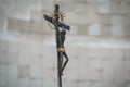 Selective focus shot of a statue portraying Jesus Christ on the cross