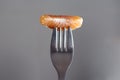 Selective focus shot of a tangerine on a fork