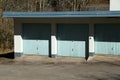 Selective focus shot of three typical garages with the same standard gates