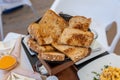 Selective focus shot of toasted bread basket on a wooden stand Royalty Free Stock Photo