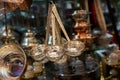 Selective focus shot of vintage golden ladles in an antique shop