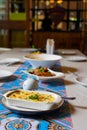 Selective focus shot of well prepared food on table with silverware and plates in restaurant shows concept of event celebration Royalty Free Stock Photo