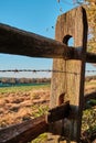 Selective focus shot of the wooden fence and barbed wire during daytime Royalty Free Stock Photo