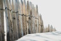 Selective focus shot of wooden fences along the sand dune of a beach Royalty Free Stock Photo