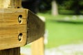 Selective focus shot of a woodpost in a park in the afternoon Royalty Free Stock Photo
