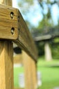 Selective focus shot of a woodpost in a park in the afternoon Royalty Free Stock Photo