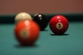 Selective focus shpt of a red billiard ball with the number three Royalty Free Stock Photo