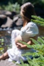 Pregnant woman posing in the woodlands Royalty Free Stock Photo