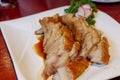 sliced crispy belly pork served on white plate. Royalty Free Stock Photo