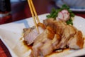 Sliced crispy belly pork served on white plate. Royalty Free Stock Photo