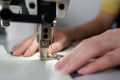 Selective focus on small steel or metallic detail of electric sewing machine