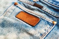 Selective focus and Soft focus / Close up of a blue jeans label. Royalty Free Stock Photo