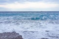 Selective focus Soft gentle waves with foam in blue ocean italy Royalty Free Stock Photo