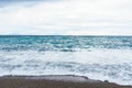 selective focus Soft waves foam in blue ocean italy coast, summer evening as background Royalty Free Stock Photo