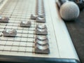 Selective focus sound mixer on the blurry microphone background.