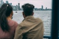 Selective focus of a South East Asian couple enjoying the view of Toronto, Canada from a ferry Royalty Free Stock Photo