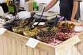 Selective focus on a stall with an assortment of olives at a traditional French food market Royalty Free Stock Photo