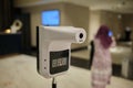 Standing digital temperature scanner at the hotel