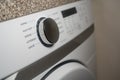 Selective focus on the start button on electric dryer