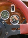 Selective focus of steering wheel and dashboard of classic car