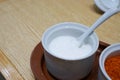 Selective focus of sugar is seasoning container set for noodle on wooden table Royalty Free Stock Photo