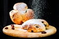 Selective focus on sweet delicious bun with raisins sprinkled wi Royalty Free Stock Photo