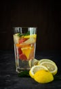 selective focus, a tall glass of water and citrus fruits Royalty Free Stock Photo
